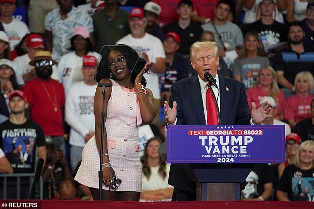 Donald Trump brings Michaelah Montgomery on stage during his rally in Atlanta, GA on Saturday, August 3, 2024