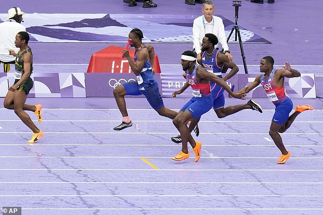 Christian Coleman, right, struggles to pass the baton to teammate Kenneth Bednarek