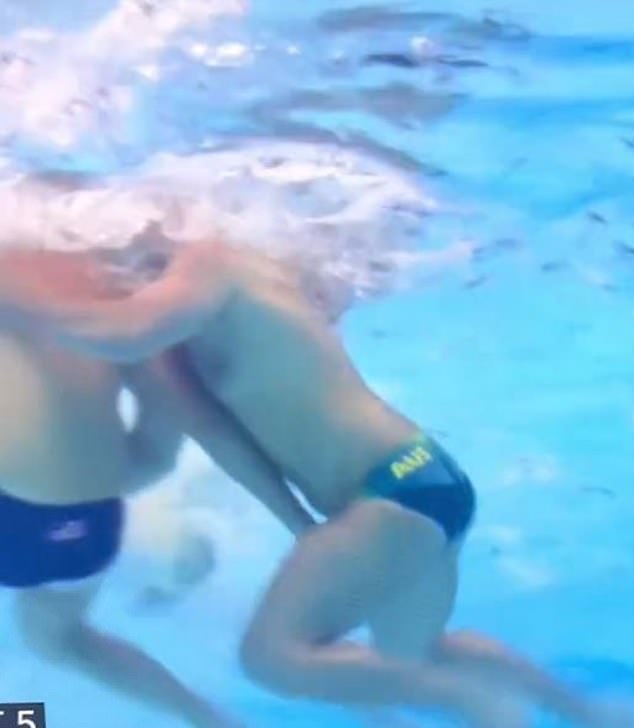 An American water polo player appeared to grab his rival's swimming trunks underwater