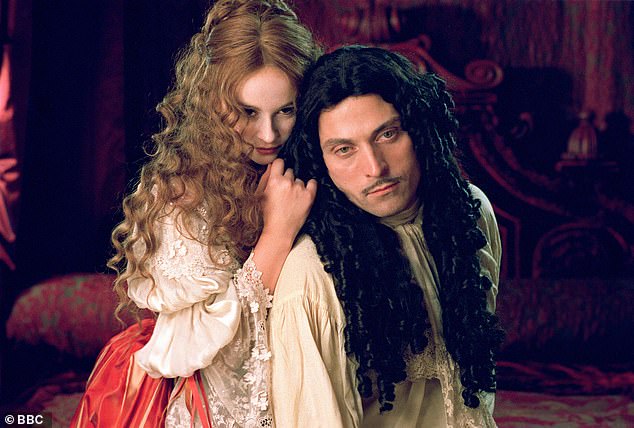 The extraordinary promiscuity of King Charles II is explored in the final episode of the Daily Mail podcast Queens, Kings and Dastardly Things. Above: Rufus Sewell as the monarch opposite Emma Pierson as mistress Nell Gwynn in the 2003 BBC series Charles II: The Power and the Passion