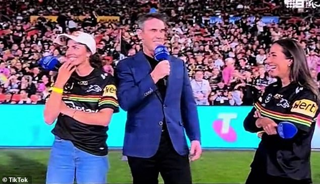 Penrith fans Jess (left) and Noemi (right) Fox endure an awkward interview with State of Origin legend Brad Fittler at Bluebet Stadium on Friday night