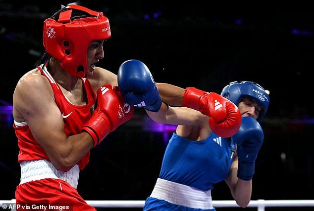 The Italian woman staggered after a cross from Algeria's Imane Khelif (in red), who had previously been banned from the World Cup because she is 'biologically male'.