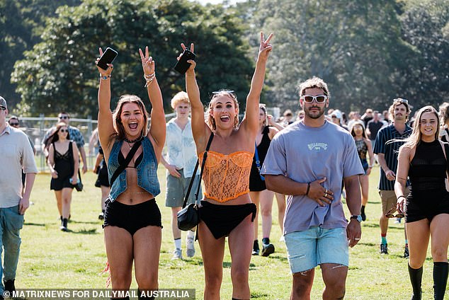 A multimillionaire is giving away a large chunk of his personal fortune to help aspiring homeowners buy their first home. Pictured: Young Australians at a music festival