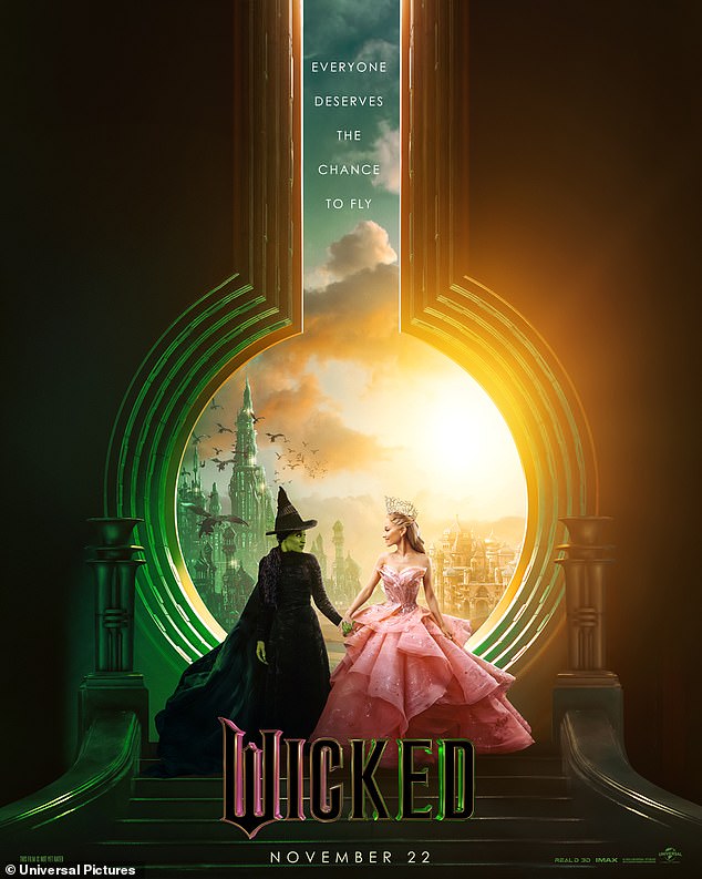 The promotional campaign for the live-action film adaptation of Wicked continued with the release of a new poster featuring stars Ariana Grande and Cynthia Erivo holding hands and gazing into each other's eyes, with Oz and Shiz University in the background