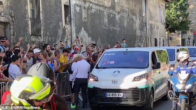 The two-time Olympic gold medalist was ushered into an Olympic bus after 31 kilometers