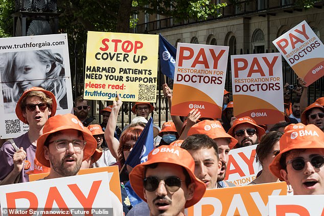 Junior doctors take part in a rally outside Downing Street in June, having each received a £177,000 pension increase thanks to the government's pay deal