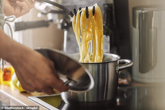 It's long been thought that cooked pasta should be rinsed under cold water to prevent the individual pieces from sticking together, but cooking experts disagree (stock photo)