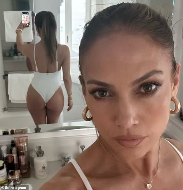 Her post featured a sizzling bathroom mirror selfie taken while she was wearing a high-cut white swimsuit that showed off her world-famous posterior