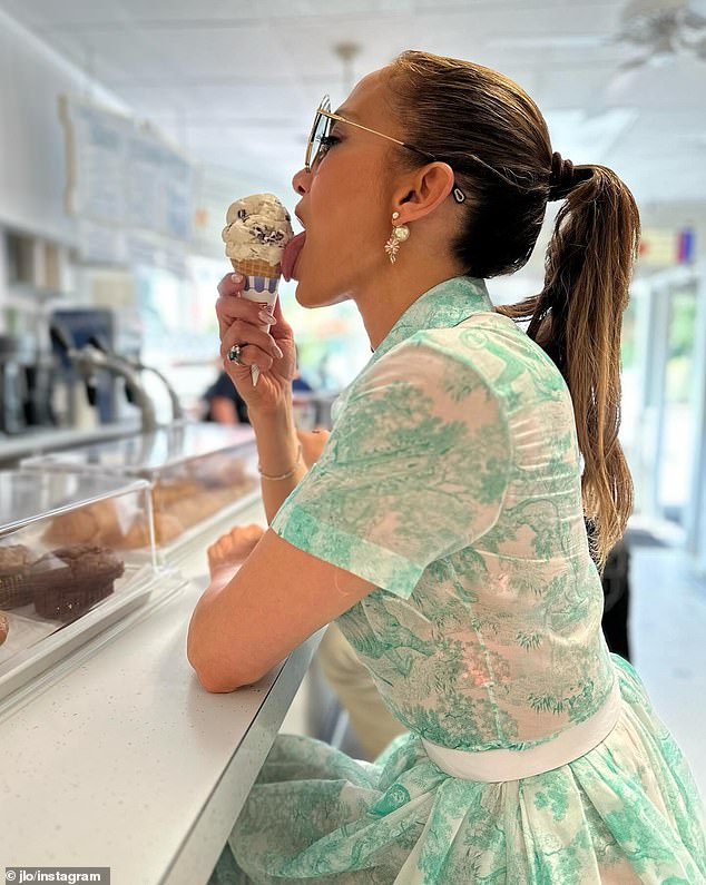 JLo was seen in a chic '50s floral dress while enjoying ice cream at an ice cream parlor, and in a plunging pink dress during a fancy restaurant dinner.