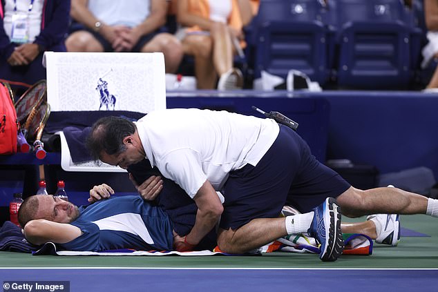 Daniel Evans is treated between matches by director of medical services Alejandro Resnicoff