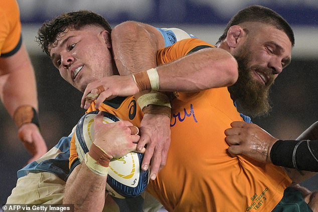 Wallabies winger Carlo Tizzano is tackled by Argentina's Los Pumas winger Marcos Kremer