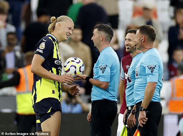 Haaland smiled as he received the match ball from referee Michael Oliver after the final score