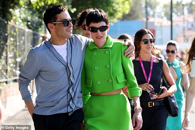 Rami held his beloved tight as they walked through the crowds in the Italian city, ready for another day of star-studded events