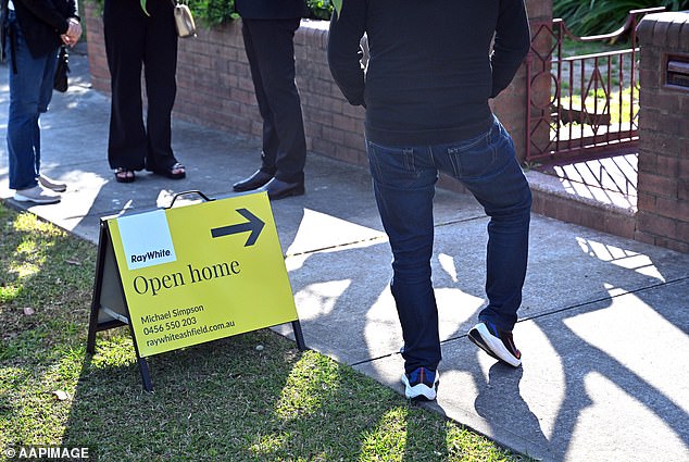 Mansour Soltani, a mortgage expert at financial comparison site money.com.au, advises first home buyers to do their research so they don't get carried away by their feelings about a property (pictured, buyers at an open house)