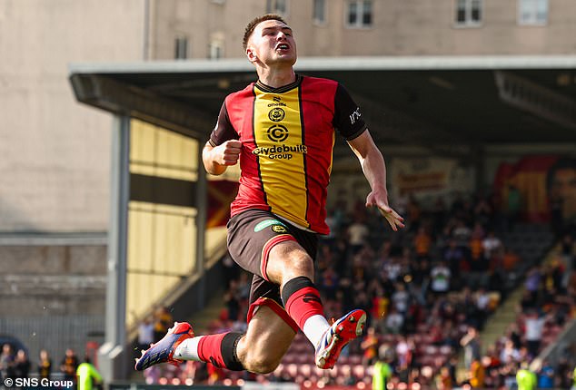 Zander MacKenzie jumps in the air after scoring a late third goal for the Jags