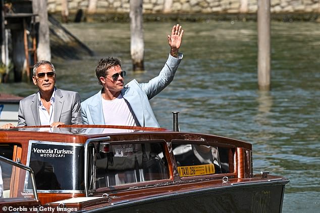 The A-listers were photographed looking handsome as they arrived by water taxi for the premiere of their film Wolfs, which screens at the festival on Sunday evening.