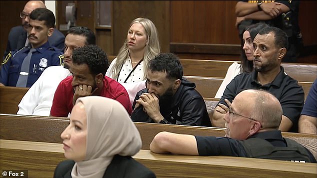 Ahmed broke down in tears in court as he saw the shocking images, clearly in distress with his head in his hands as the sound of gunfire echoed through the court