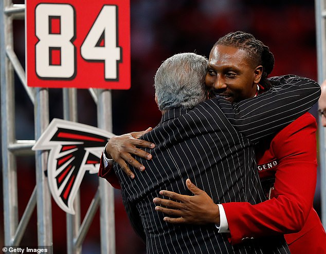 White was inducted into the Falcons' Ring of Honor in 2019 (seen with owner Arthur Blank)