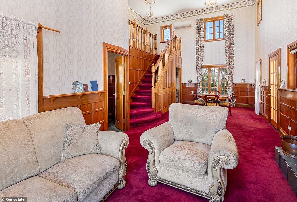 Inside, medieval grandeur awaits, combined with wooden interior features. There is a formal living and dining room fitted with a royal red carpet and a large fireplace