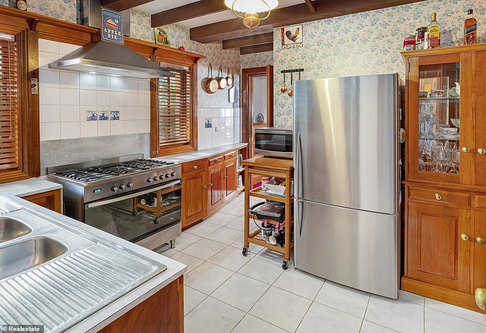 At the heart of the castle is the wooden kitchen with an eight-burner stove, a large oven, enough space for a double refrigerator and ample work space