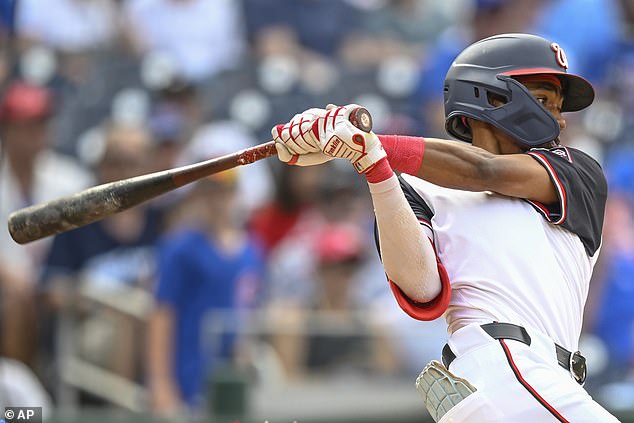 Washington Nationals' Darren Baker hits his first Major League hit in the ninth inning