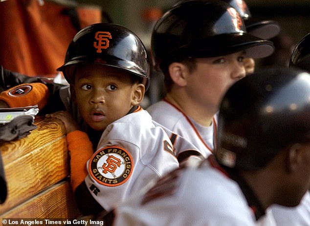 Batboy Darren Baker sits in the dugout in Game 6 after playing a key role in Game 5