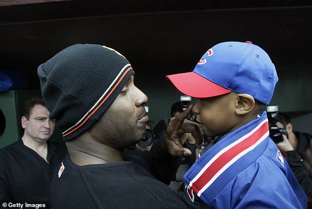 Giants' Barry Bonds Giants talks to Darren Baker, son of manager Dusty Baker in 2003