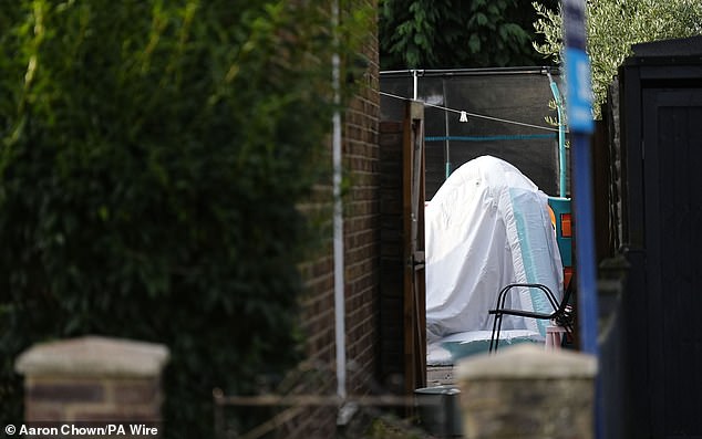 A view into the back garden of the property in Bremer Road, Staines-Upon-Thames where three children and a man were found