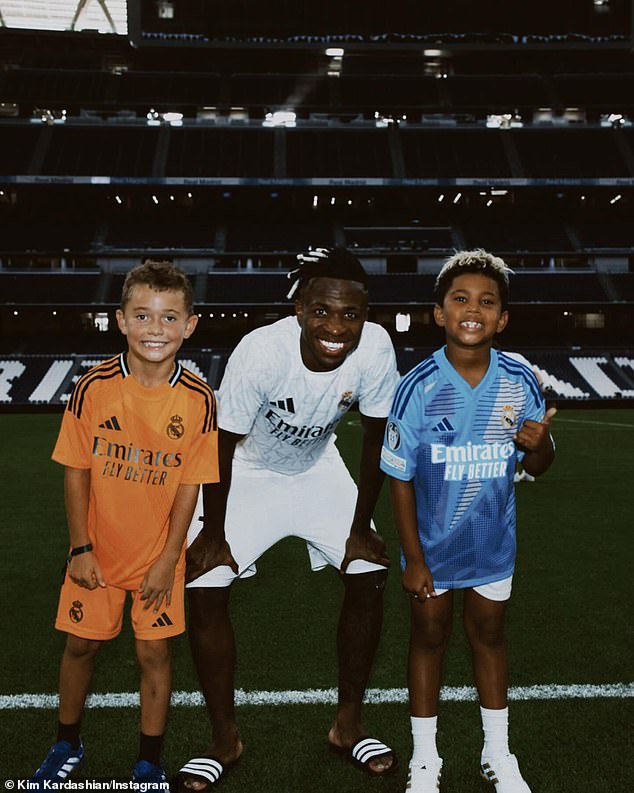 She then added a funny snap of the two children posing next to Real Madrid's Vinicius Junior