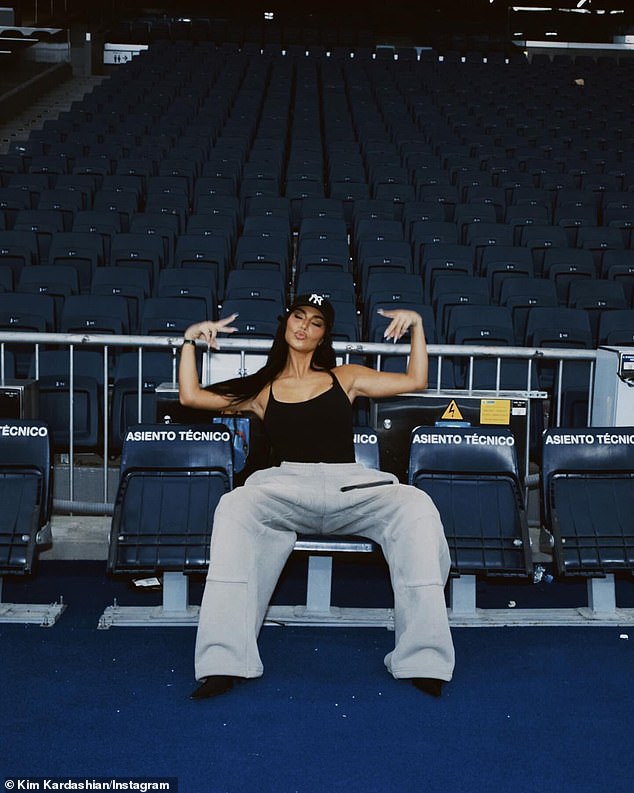 She also posted a solo photo of herself posing again with peace signs in the stands