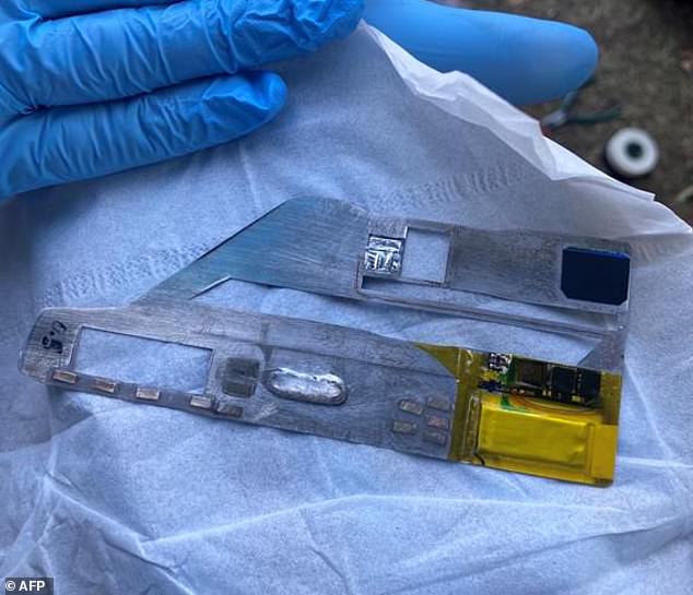 The pair used a 'shimming' device (pictured) to clone ATM users' card details