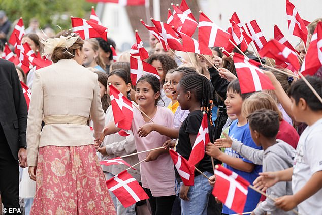 Queen Mary greets children attending the Peter Willemoes School in Assens - at every stop people queued to meet the royals