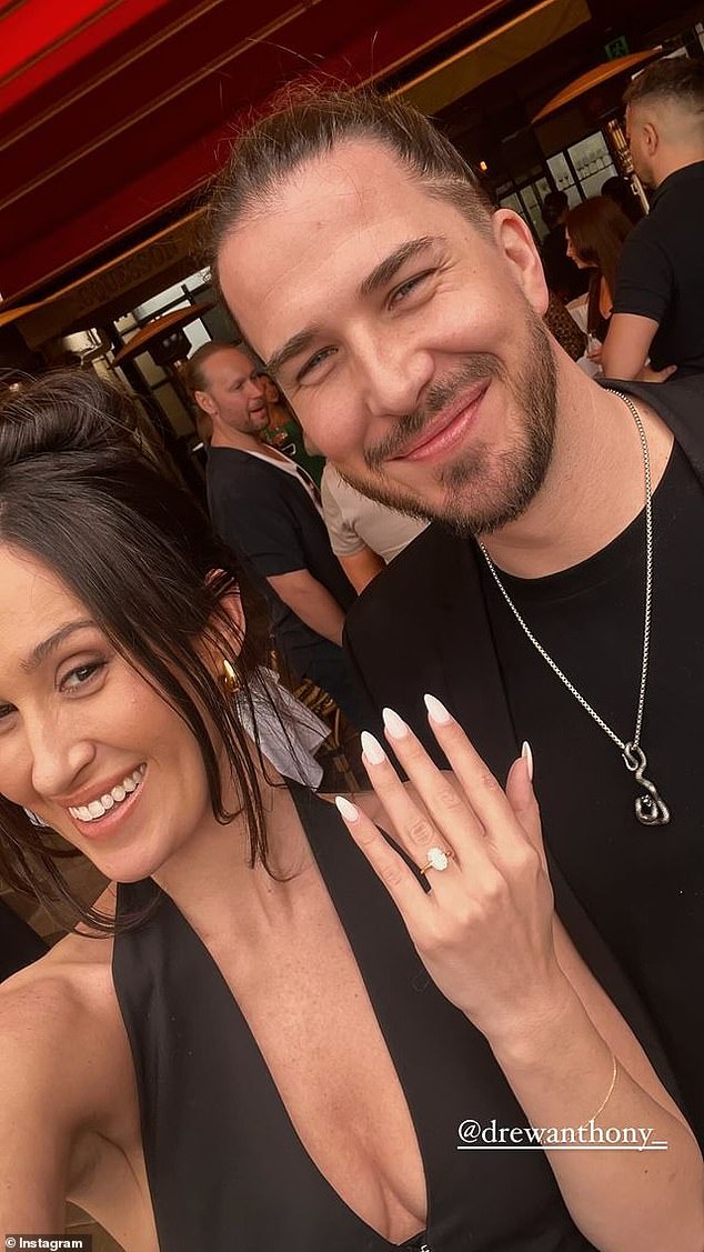 In one photo, Anthony is seen smiling next to Bianca as she holds up her hand to show off a stunning engagement ring