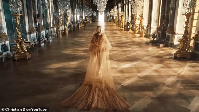 At one point, Riri (born Robyn Fenty) takes off a sheer cape while walking around the Hall of Mirrors in the 17th-century estate.