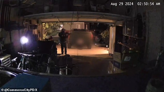 The thieves were captured on camera shining their flashlights through the garage