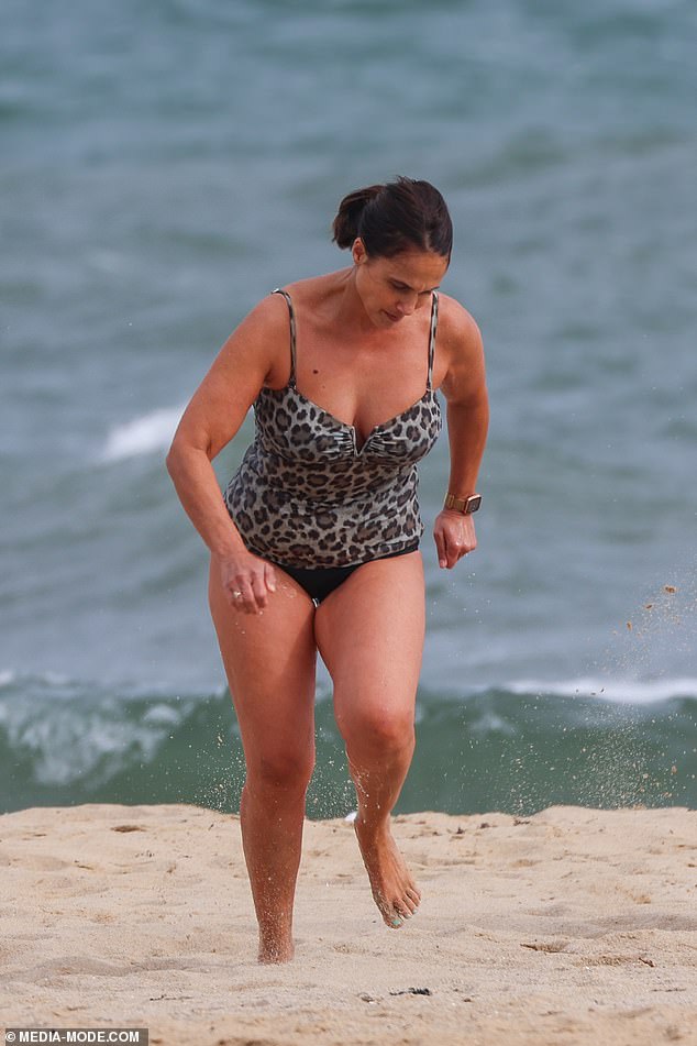 His wife Holly wore a leopard print swimsuit before changing into a Wrangler print T-shirt after the dip