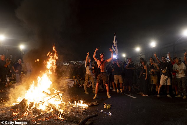 Protesters set fire to a main road during a demonstration demanding a deal on hostages and criticizing Israeli Prime Minister Benjamin Netanyahu