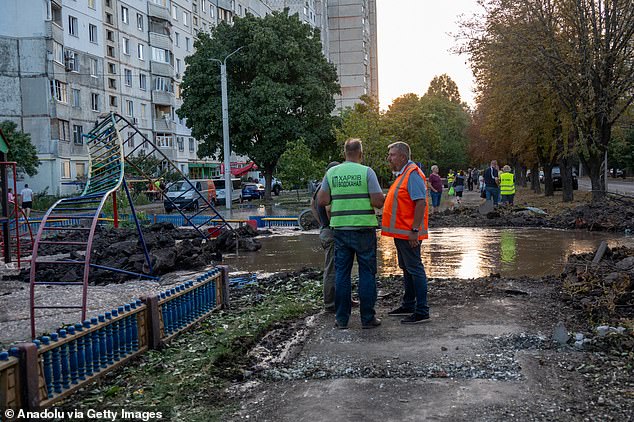 A crater from a Russian rocket explosion near a sports complex filled with water due to damage to a water pipe, in Kharkiv, Ukraine on September 1