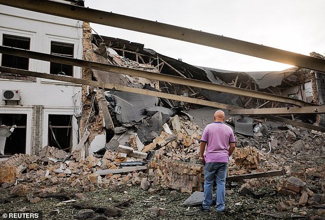 A man looks at the damaged site of the Russian missile attack on an office building, amid the Russian-Ukrainian conflict, in Kiev, Ukraine, September 2, 2024