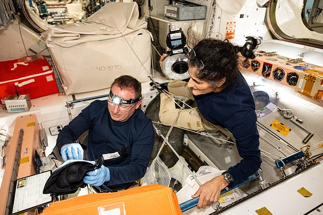 NASA astronauts Butch Wilmore and Suni Williams, Boeing's Crew Flight Test Commander and Pilot, respectively, inspect safety hardware aboard the ISS on August 9, 2024