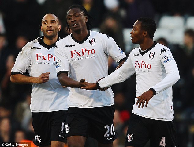 Paintsil (right) played six years in England, three of which he spent with Fulham