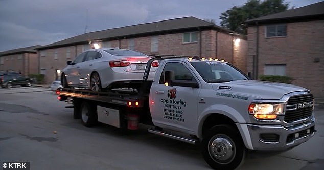 Pictured: Beckett's car is towed from the scene of the gruesome crime in Houston