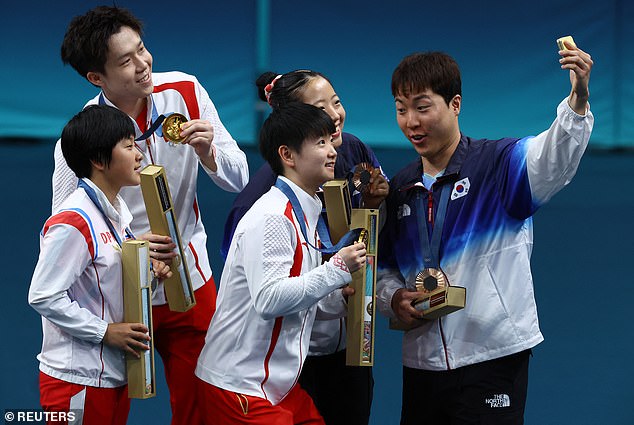 The photos have caused a stir in North Korea as the athletes were seen laughing with their rivals