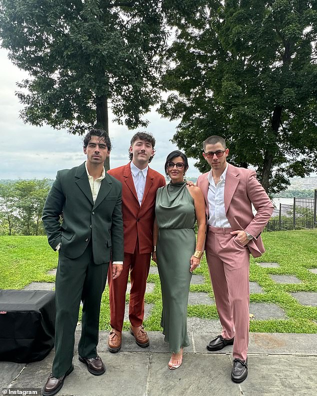 It was definitely a family affair, as Nick also shared a photo of himself posing with mother Denise, younger brother Frankie and older brother Joe (seen from right to left)