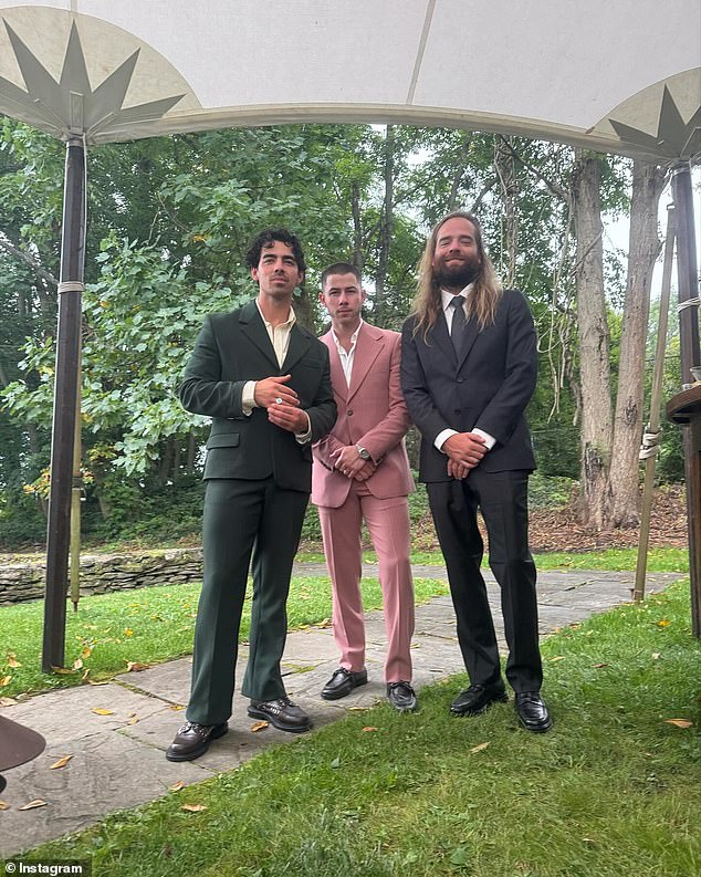 The two brothers posed with Jonas Brothers drummer Jack Lawless