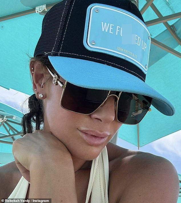 She also wore a baseball cap with an explicit slogan for one of the vacation snaps