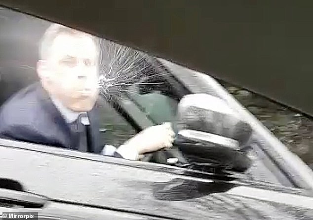 Carragher was caught on video spitting at a car carrying a man and a 14-year-old girl