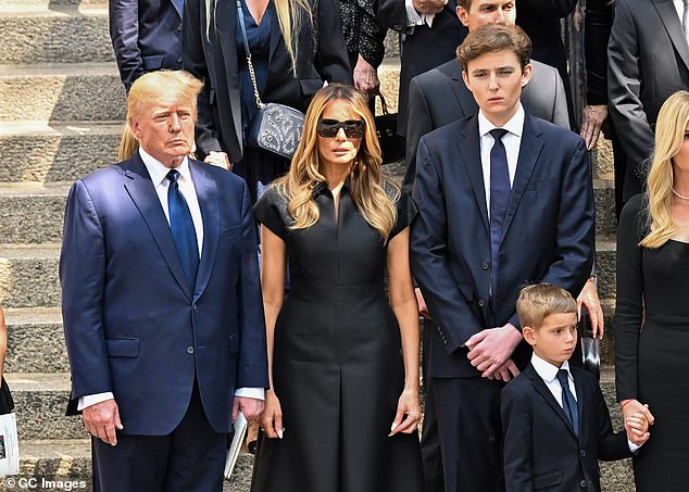 Trump explained that Melania watched the rally live and was shocked when she heard gunshots and saw him dive to the ground, behind the podium. He is pictured with his wife and their son Barron at the funeral of Ivana Trump on July 20, 2022 in New York City