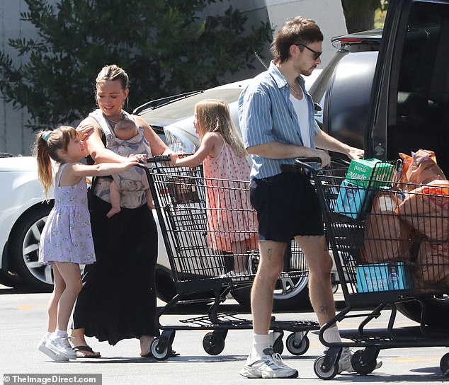 The 36-year-old mother of four and her husband Matthew Koma, 37, enjoyed a grocery shopping spree with five-year-old Banks, three-year-old Mae and their newest addition to the family, baby Townes