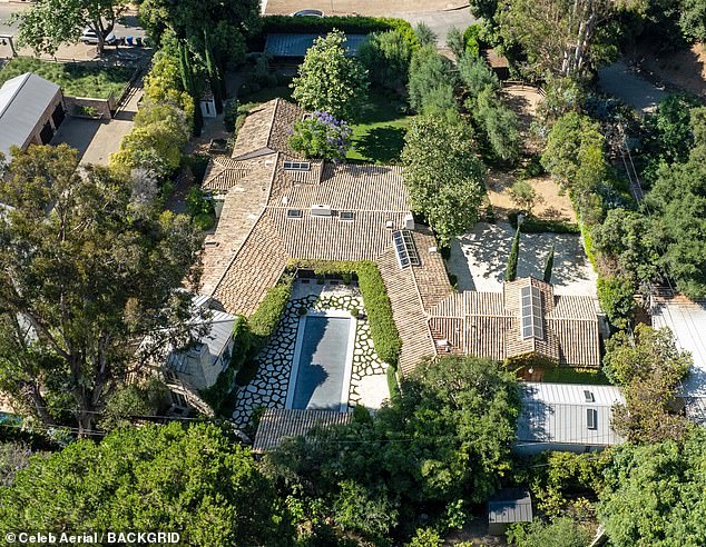 The 52-year-old actor, who recently received takeout at his new home (pictured), is doing well despite his legal separation from his fellow A-lister, 55